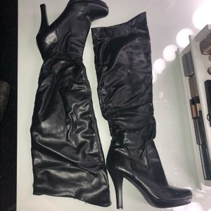 Black leather knee high heel boots